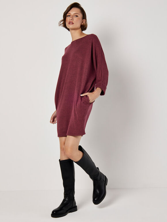A wine-red knitted dress with ruffled edges and a tubular shape
