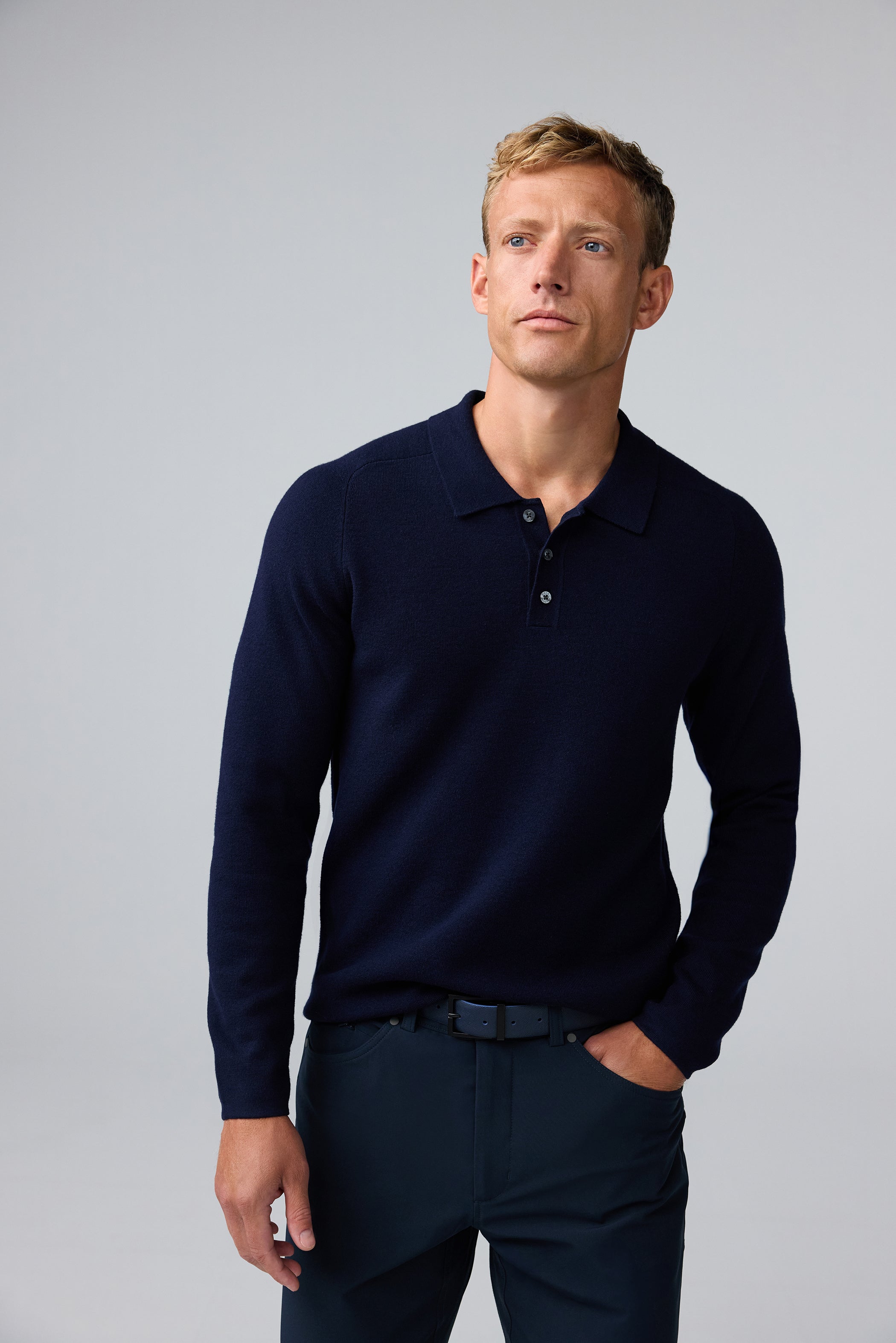 Front view of man wearing Tech Merino Sweater Polo in Total Eclipse