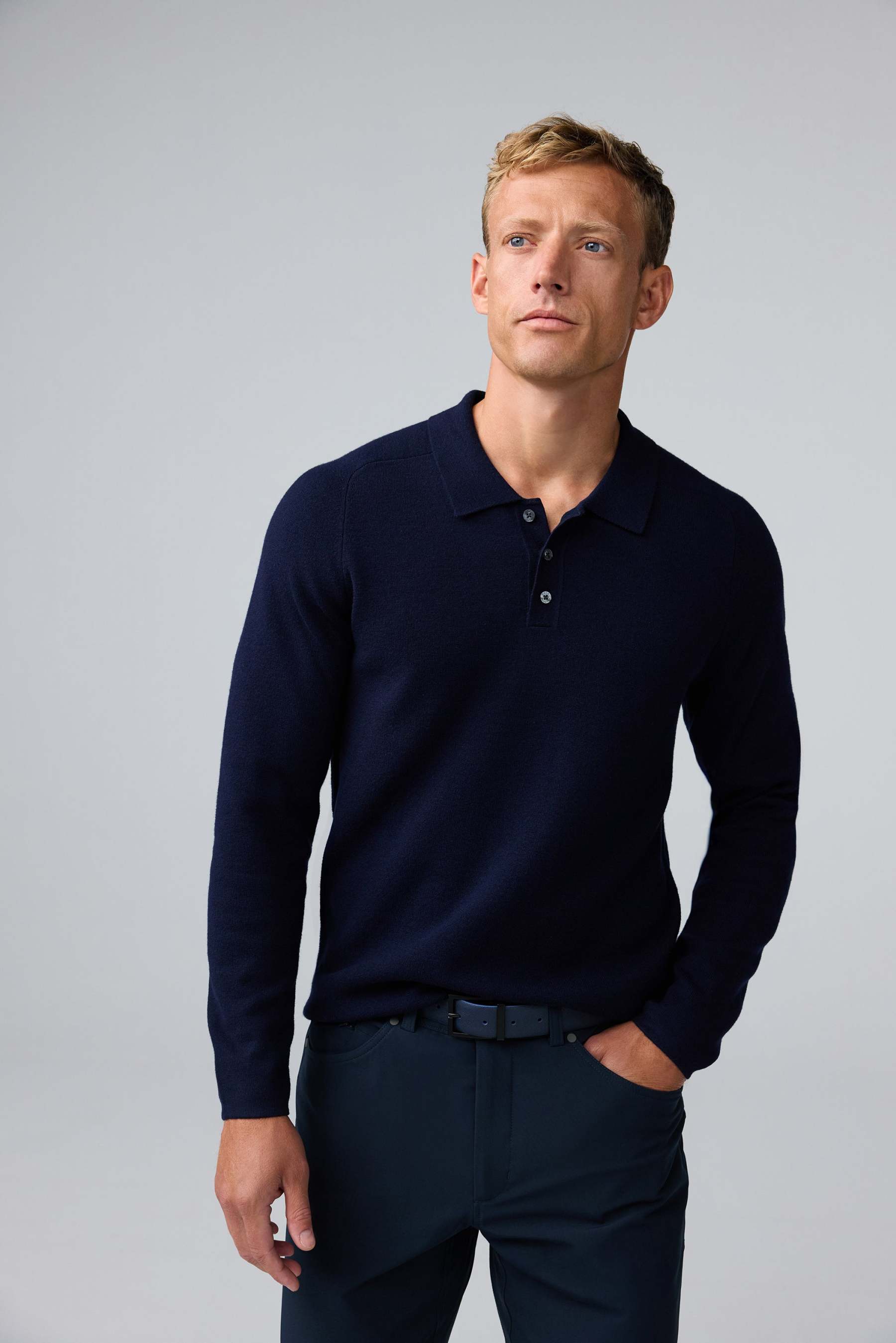 Front view of man wearing Tech Merino Sweater Polo in Total Eclipse
