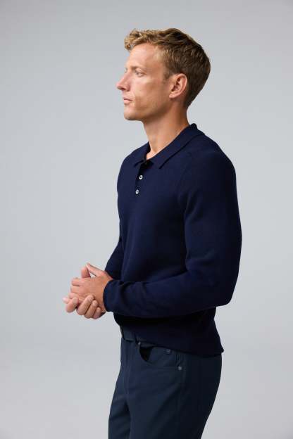Side view of man wearing Tech Merino Sweater Polo in Total Eclipse