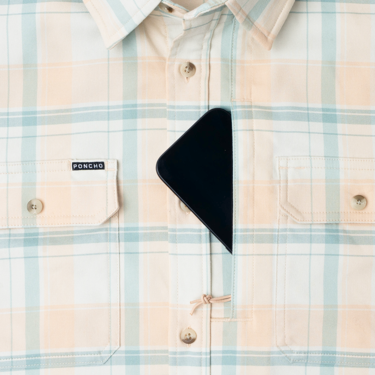 phone in chest zipper pocket of shirt