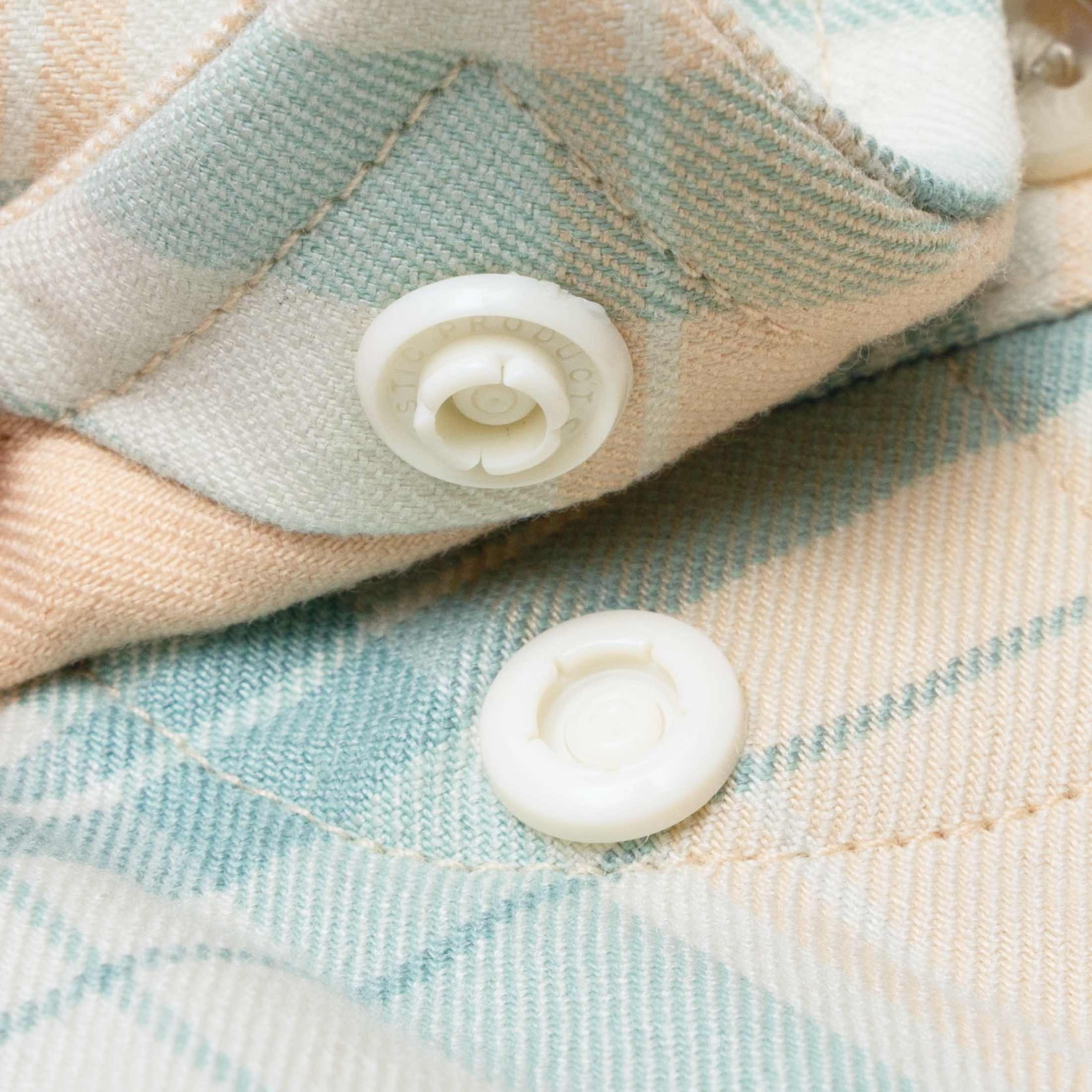 closeup of collar snaps on shirt