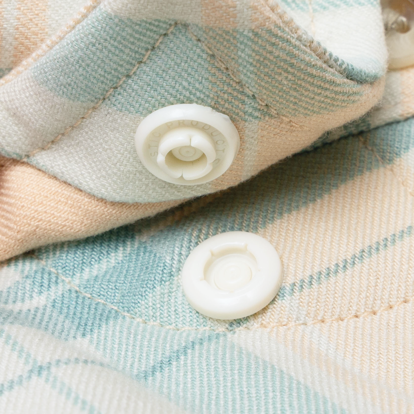 closeup of collar snaps on shirt
