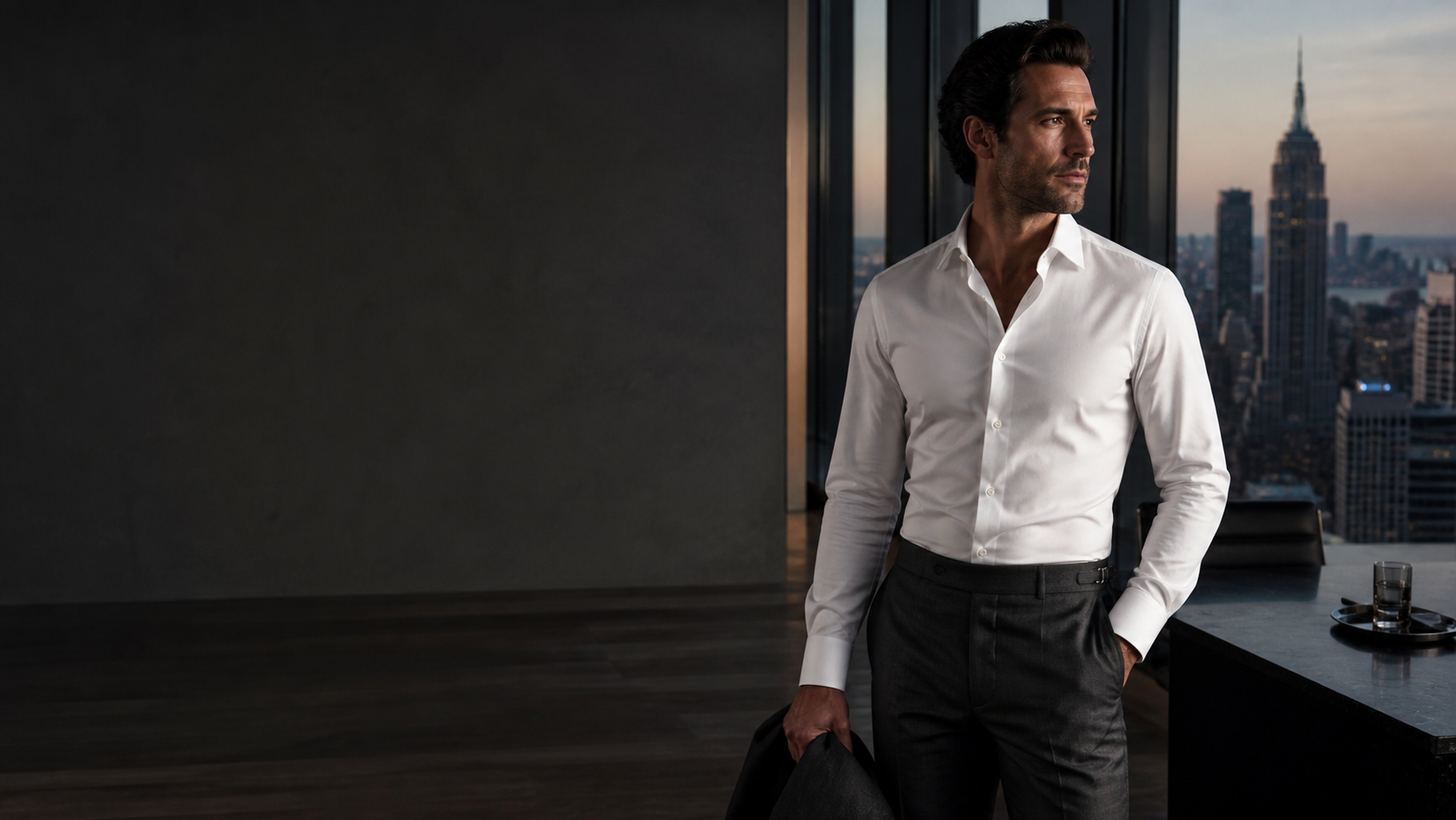 OWNDREAM professional in a premium white stretch shirt overlooking the city