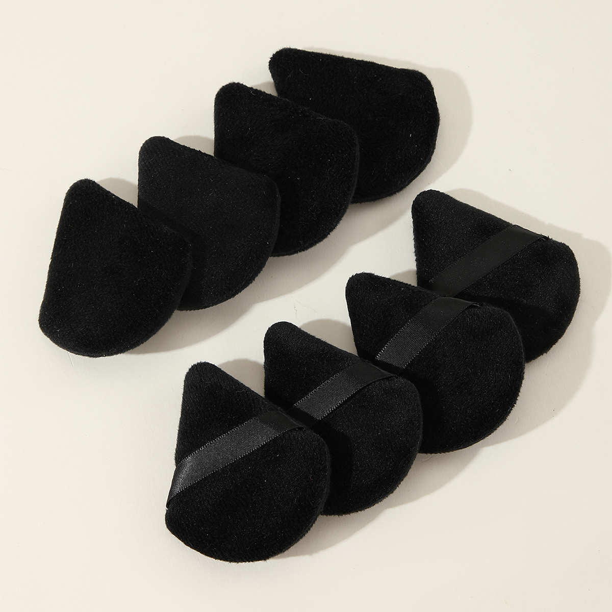 Eight Black Triangle Scalloped Powder Puffs