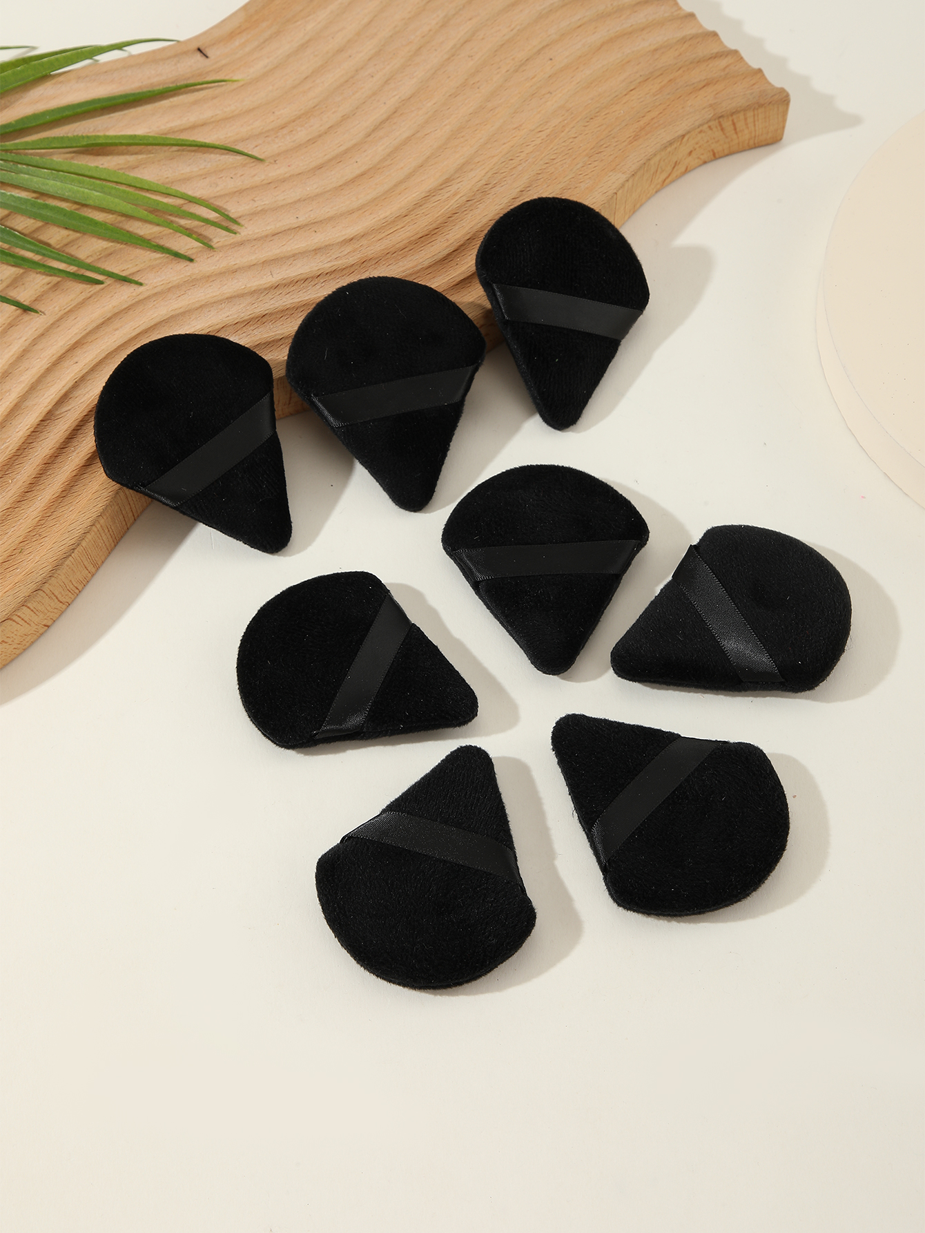 Eight Black Triangle Scalloped Powder Puffs
