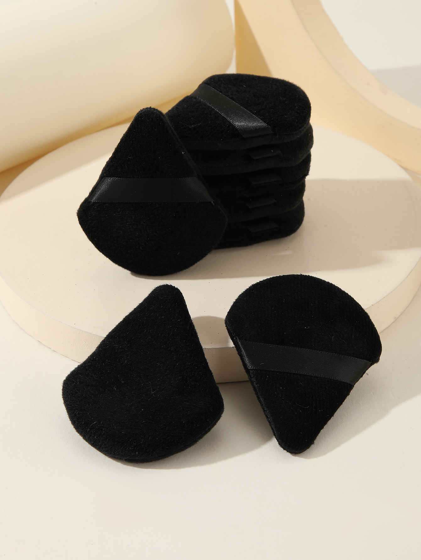 Eight Black Triangle Scalloped Powder Puffs