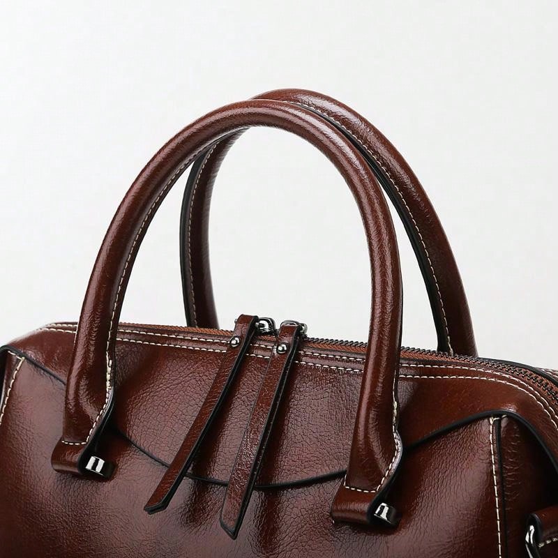 A retro brown leather handbag with double zippers, large capacity, simple space, European and American style, arm-in-arm on one shoulder, suitable for women's daily dating gifts.