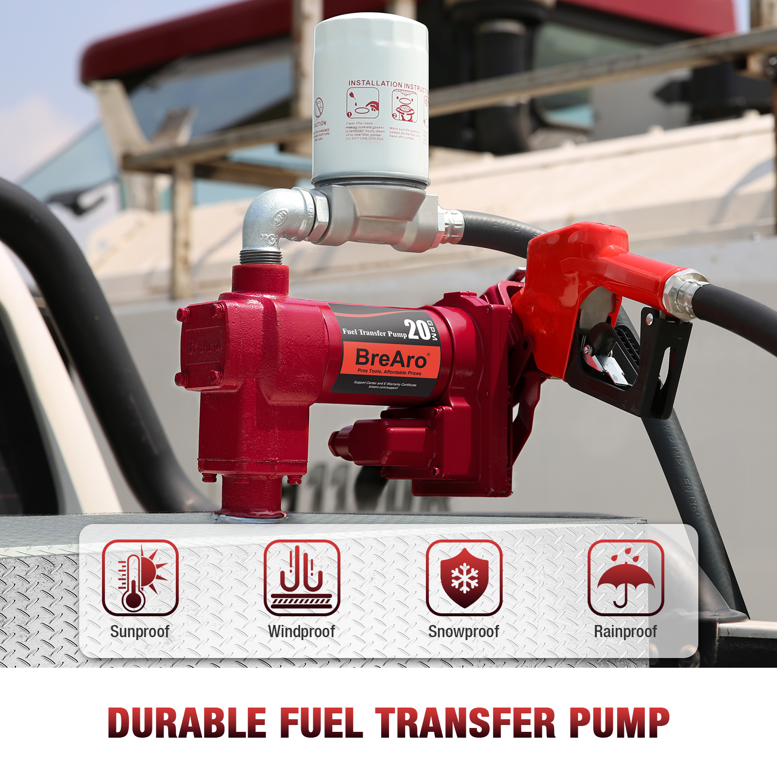 A red BreAro 20 GPM fuel transfer pump installed on a truck bed, featuring a mounted premium filter and a red automatic fuel nozzle. The image highlights the pump's durability with icons indicating it is sunproof, windproof, snowproof, and rainproof, ensuring reliable performance in various weather conditions. The text below reads "Durable Fuel Transfer Pump," emphasizing the product's resilience and suitability for outdoor and industrial applications.