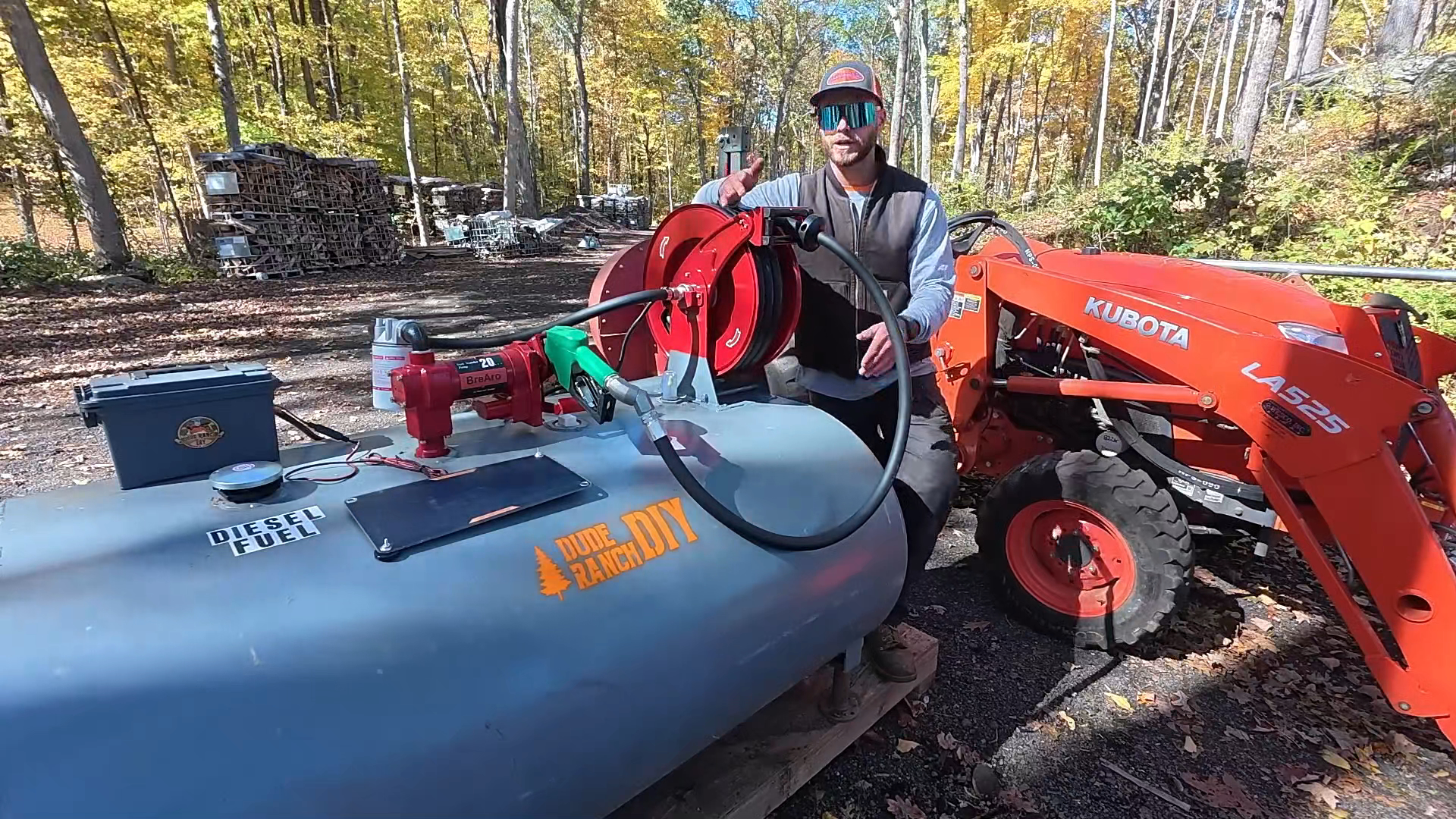 Brearo Retractable Hose Reel in use at a farm workshop, highlighting its efficiency and space-saving design for fuel management.
