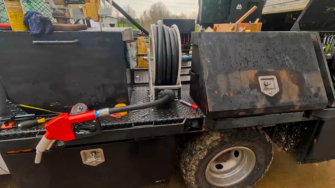 Brearo diesel fuel hose reel with auto shut-off nozzle on vehicle bed, ready for fueling. Cr:@griggsfarmsllc