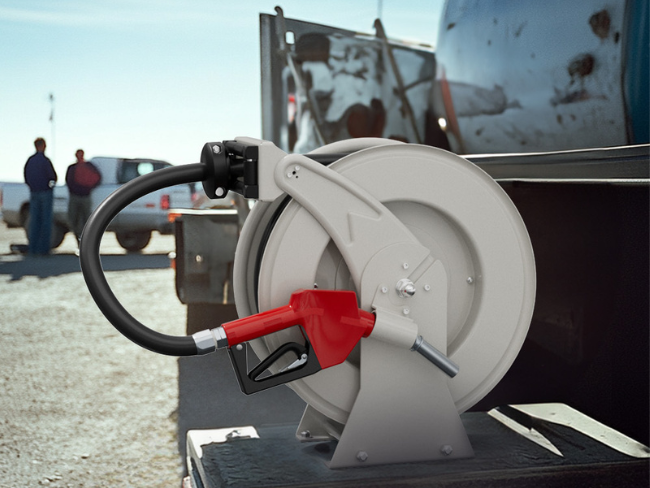 Brearo fuel hose reel with a red fuel nozzle mounted on a truck, designed for industrial and fuel transfer applications.