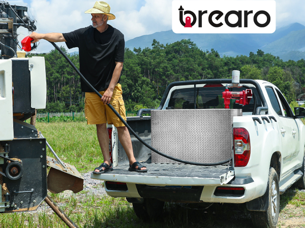 BreAro fuel transfer pump refueling farm machinery in remote field using 12V diesel pump with auto nozzle.