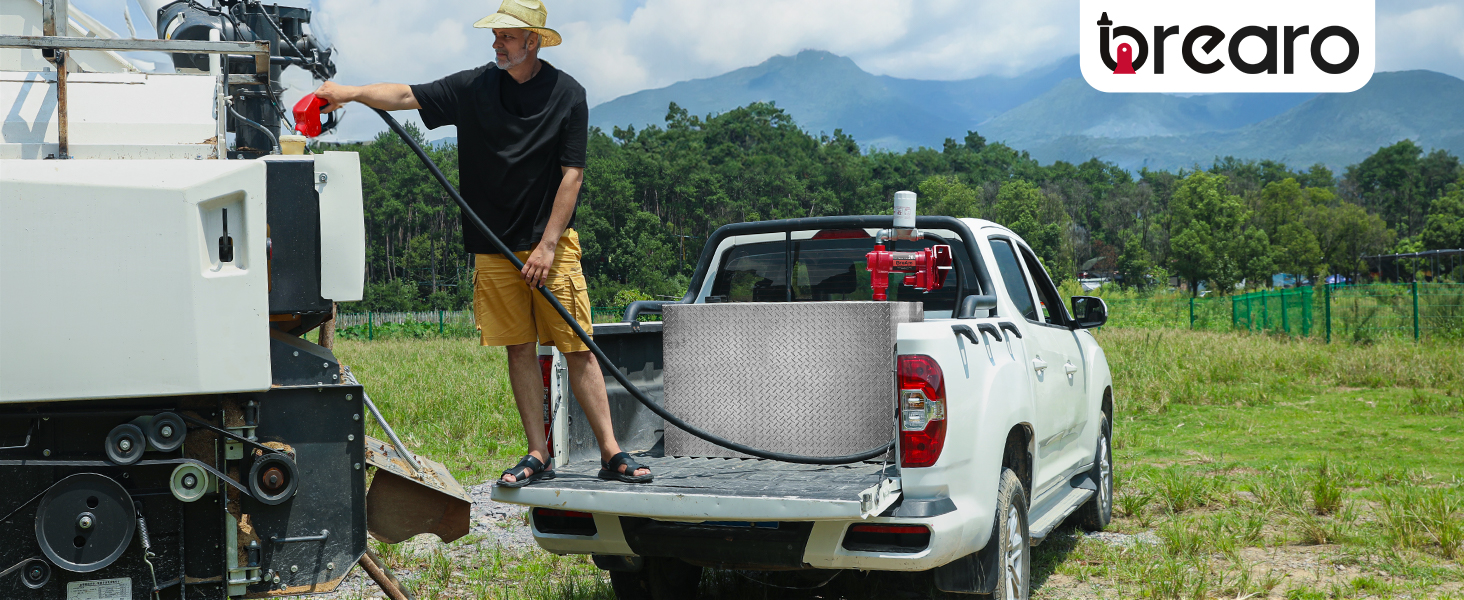 BreAro fuel transfer pump refueling farm machinery in remote field using 12V diesel pump with auto nozzle.