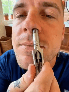 Manual nose hair trimmer demonstration GIF