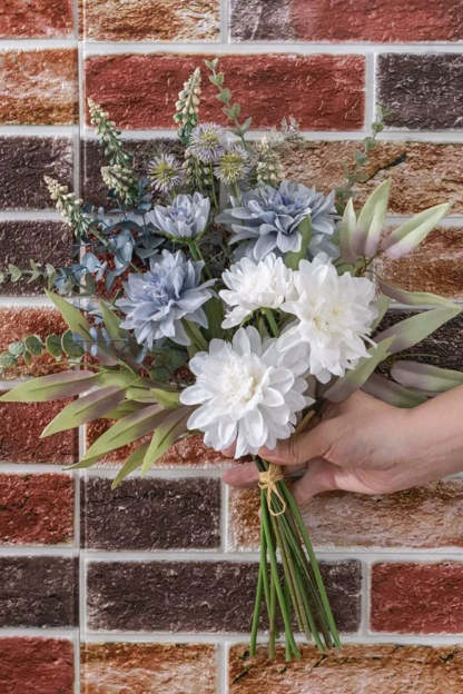 White Hand Holding Artificial Flower Bridal Bouquet