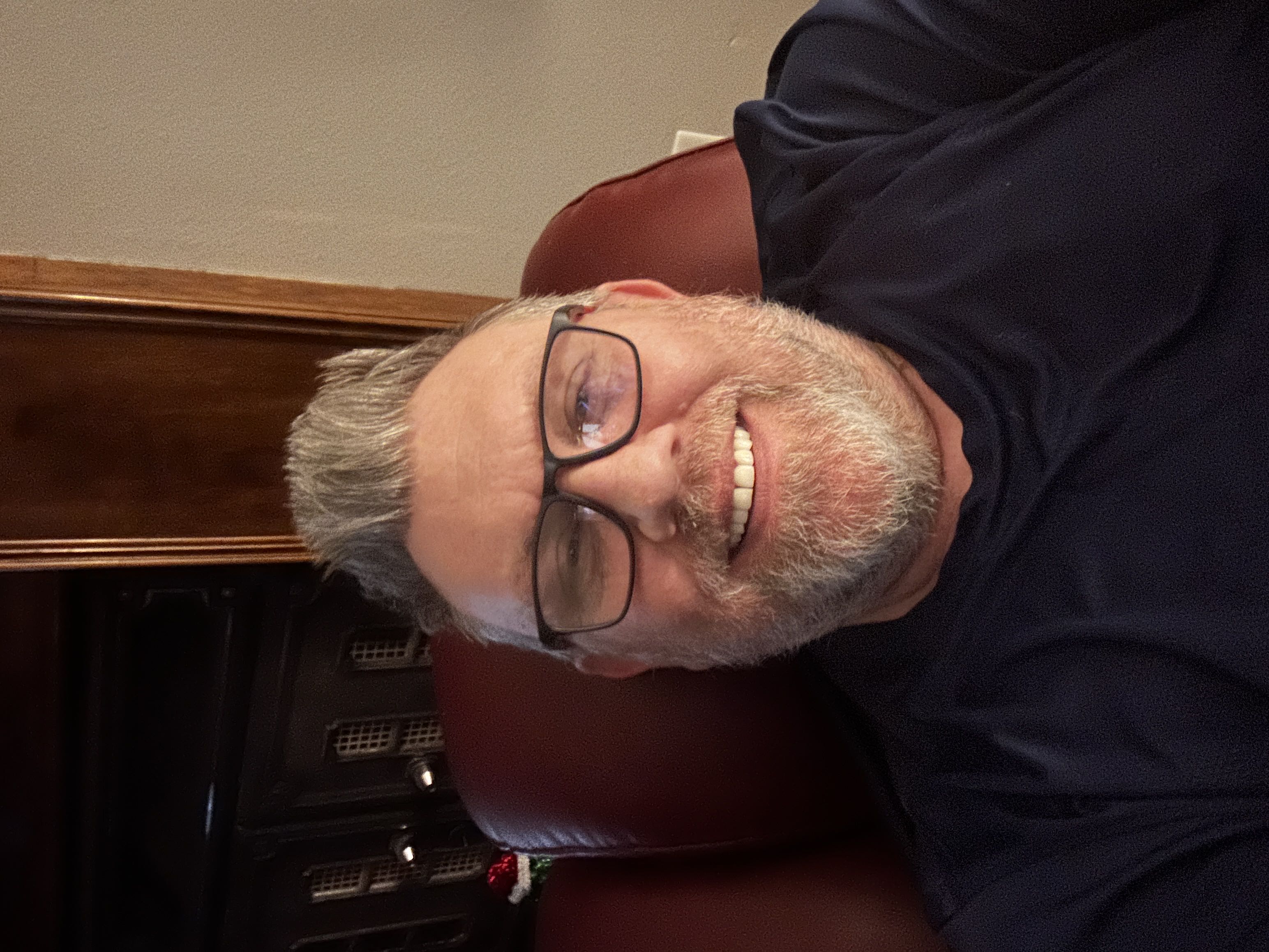 Customer wearing Manlykicks anti-blue light glasses at computer