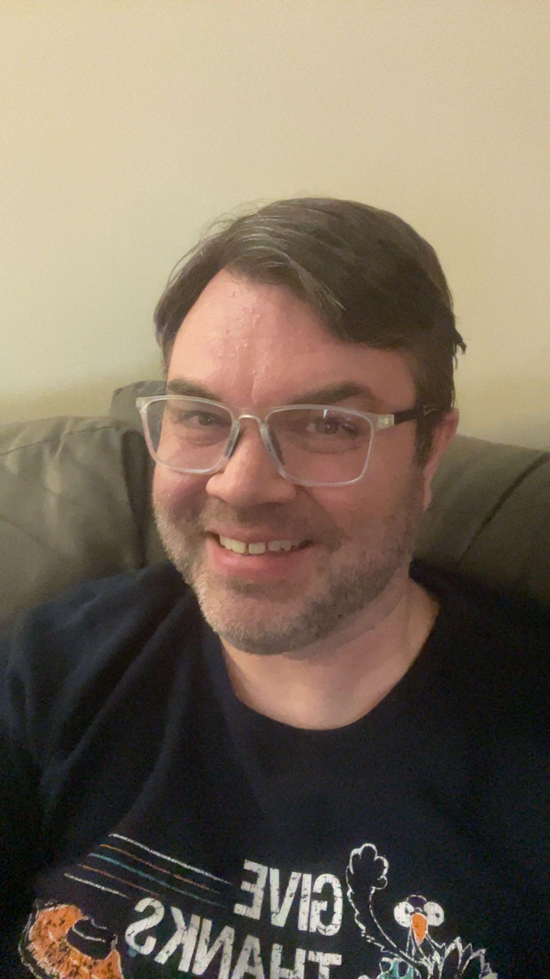 Customer using Manlykicks photochromic reading glasses