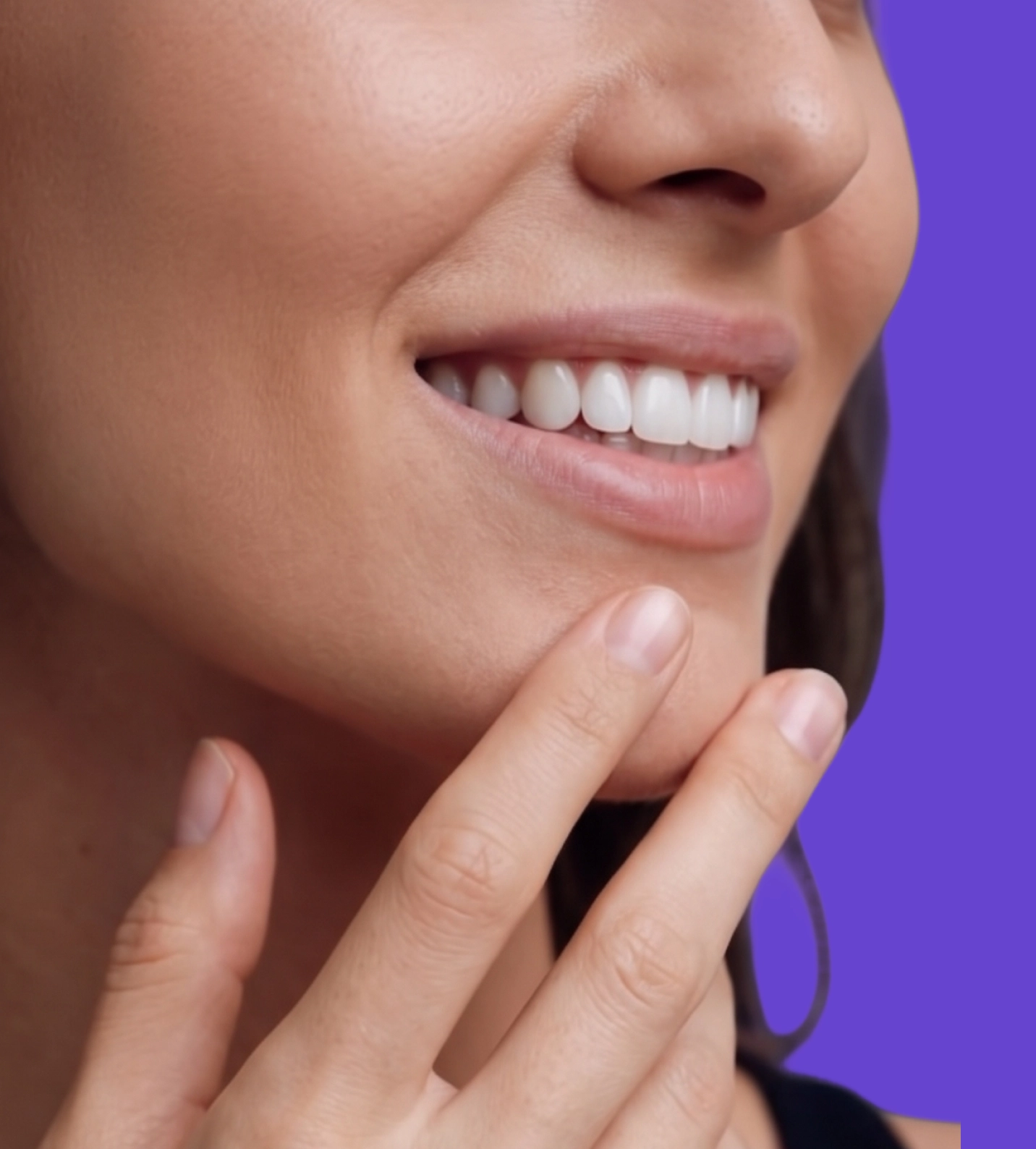 A confident person smiling after whitening with Asuno
