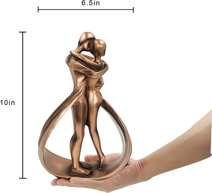 Romantic lovers embrace statue