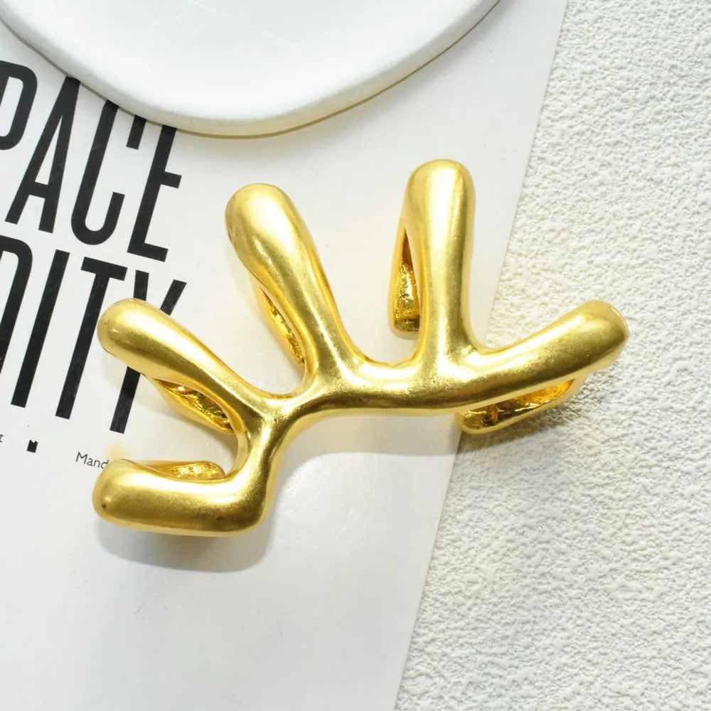 Sculptural hand-armor ring