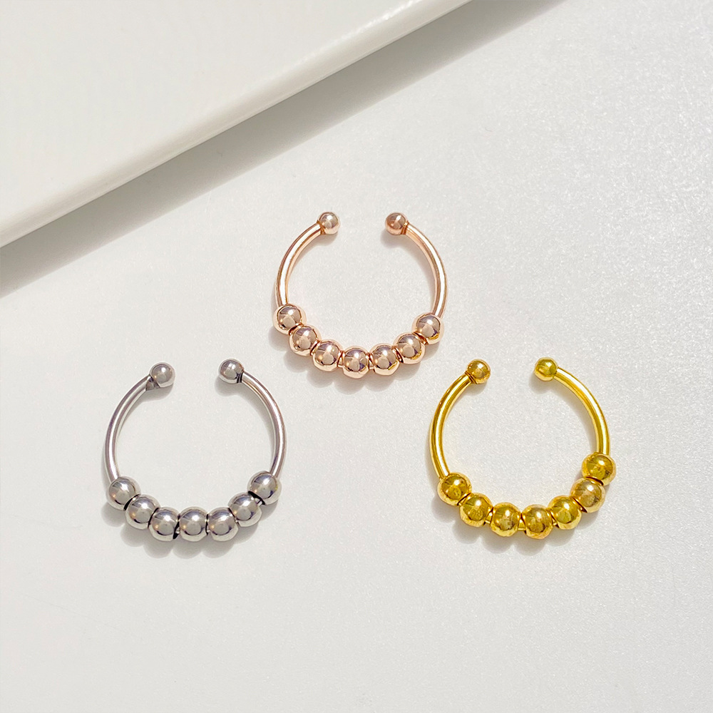 Rotatable stress-relieving anxiety bead ring