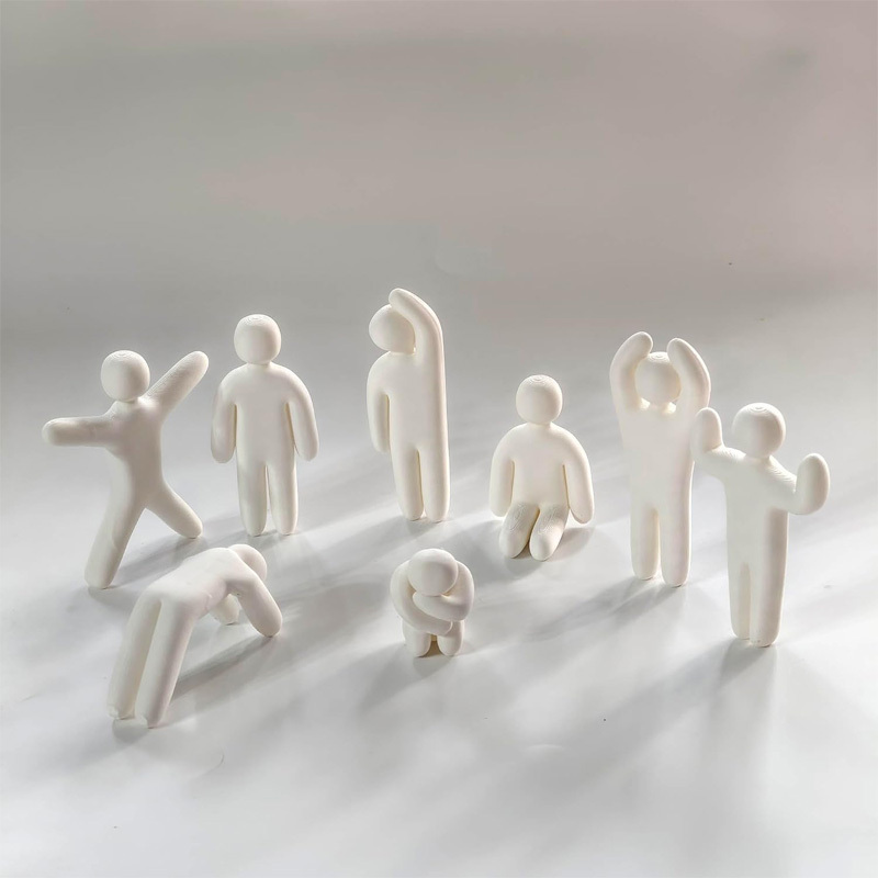 Miniature doll statue