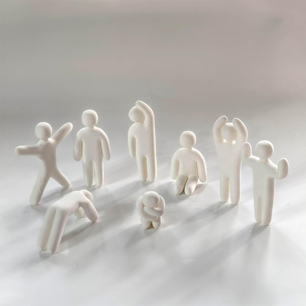 Miniature doll statue