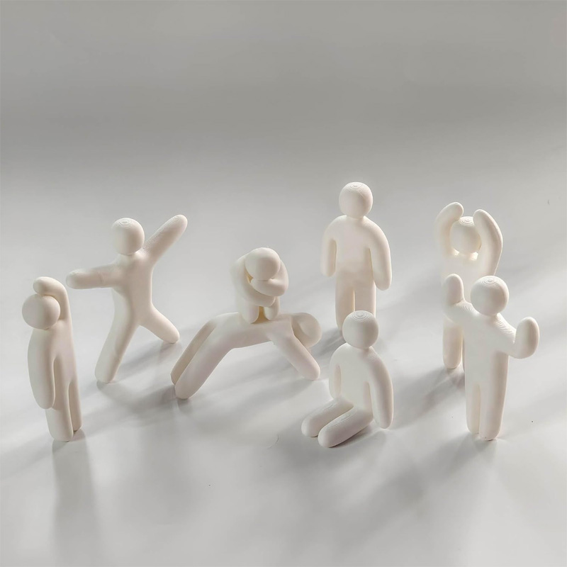 Miniature doll statue