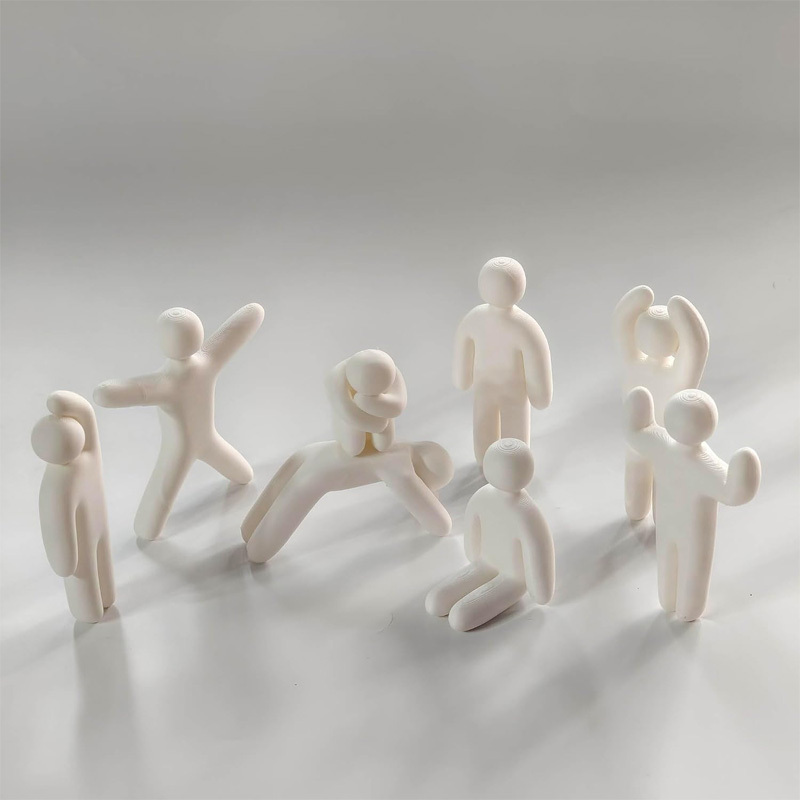 Miniature doll statue