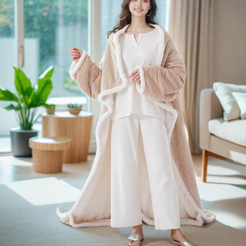 Wearable heated blanket with foot bag