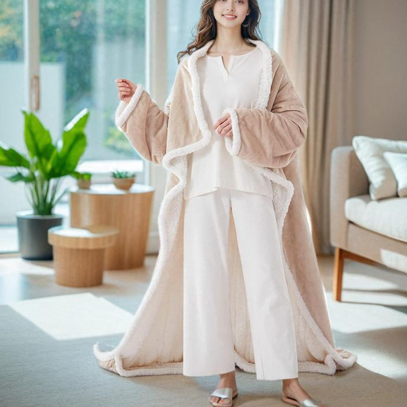 Wearable heated blanket with foot bag