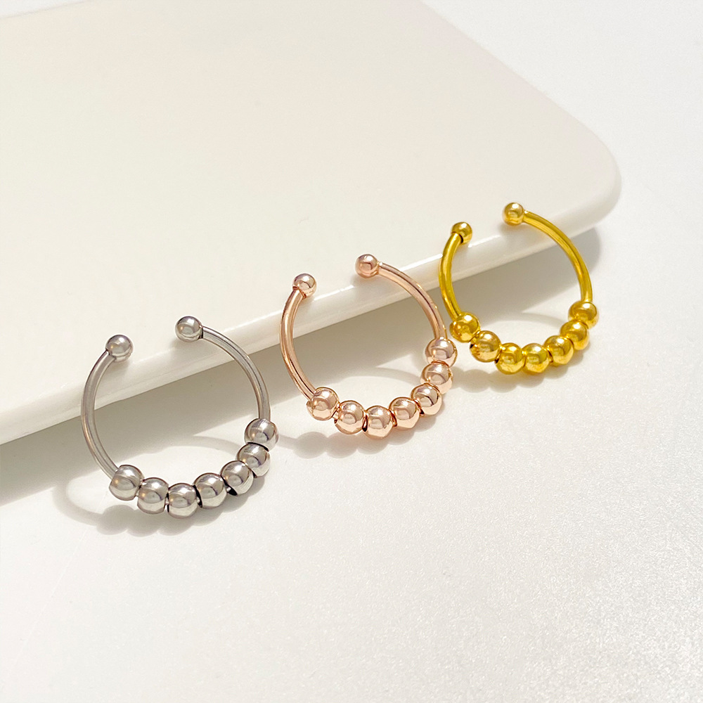 Rotatable stress-relieving anxiety bead ring