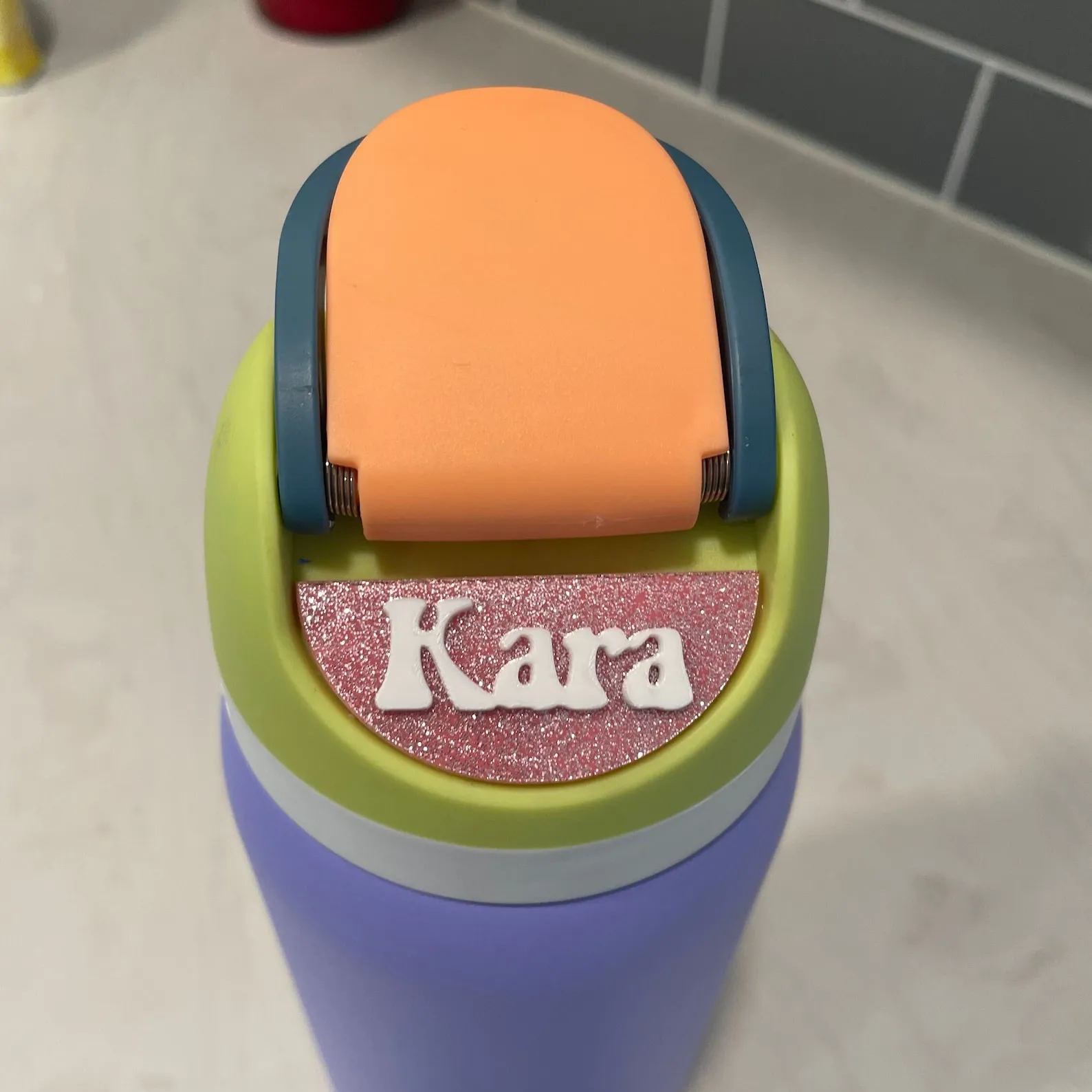 Reusable adhesive nameplate