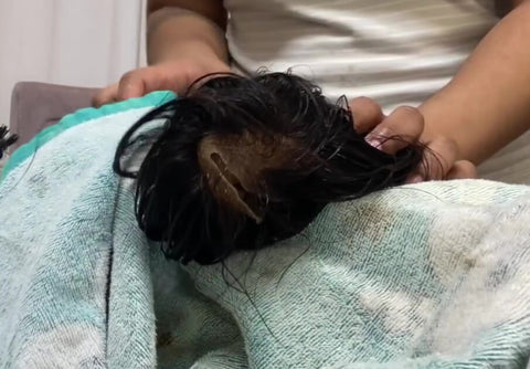 put you wig on a dry towel and pat it dry