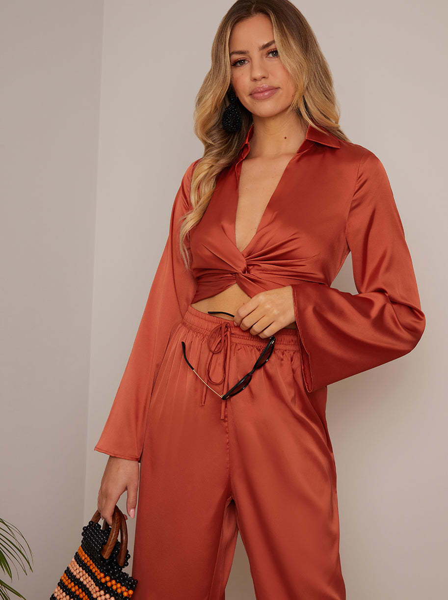 Long Sleeve V Neck Satin Twist Detail Top in Burnt Orange