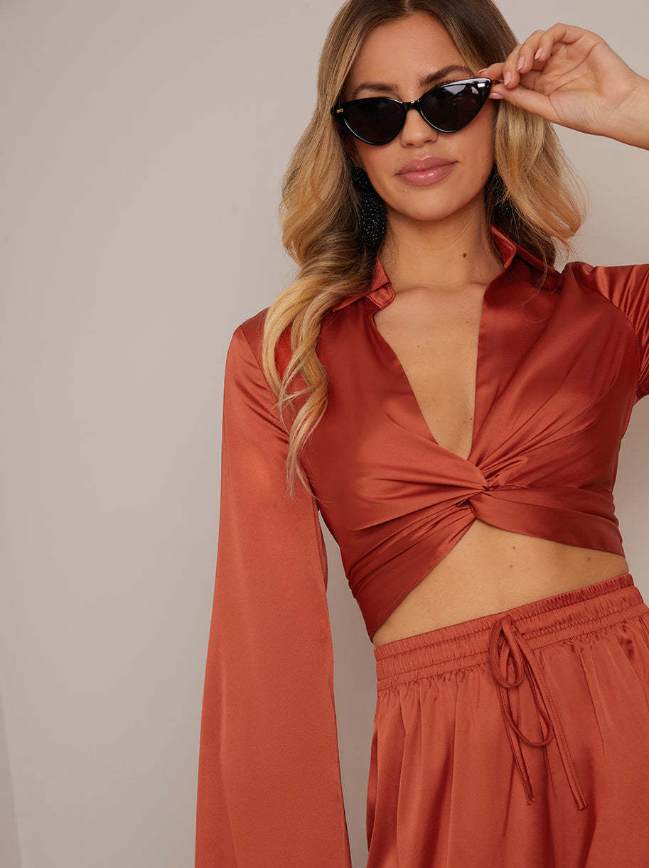 Long Sleeve V Neck Satin Twist Detail Top in Burnt Orange