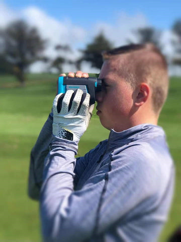 Logan Scherpe uses a Mileseey golf rangefinder