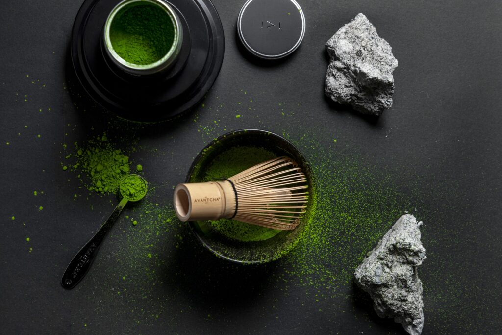 ceremonial grade matcha in a matcha bowl with matcha whisk