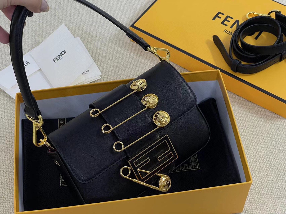 F-I Joint mini golden laser baguette bag in Milan Fashion Week street shooting.