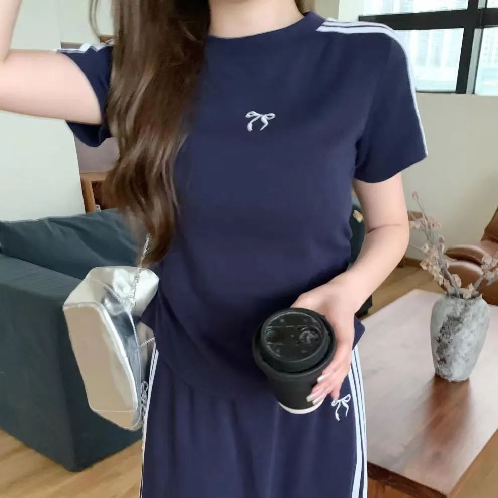 【套裝】慵懶風休閒時尚短袖t恤高腰A字裙運動風兩件套裝-HaloBless