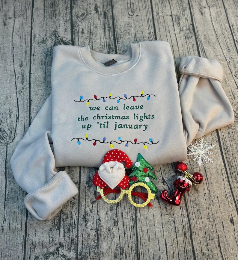 We Can Leave The Christmas Lights Up 'Til January sweatshirt , Embroidered Christmas Lights Cut Hem sweatshirt, Side Bow Appliqué Sweatshirt