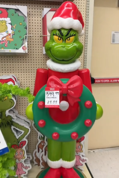 63-Inch Grinch LED Nutcracker Holding Wreath