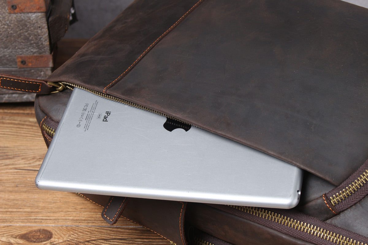 leather laptop bookbag with adjustable strap and leather belts and shoulder-strap