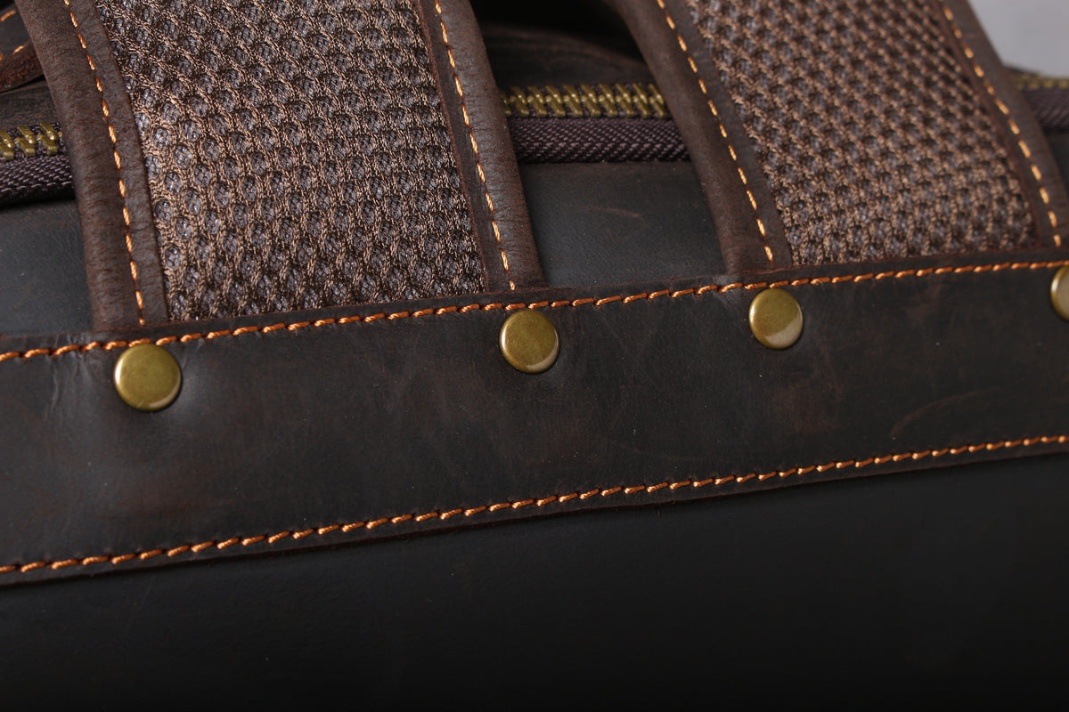 brown leather hiking backpack with roomy organizer to store a toiletry pouch, garment, jackets or other belongings