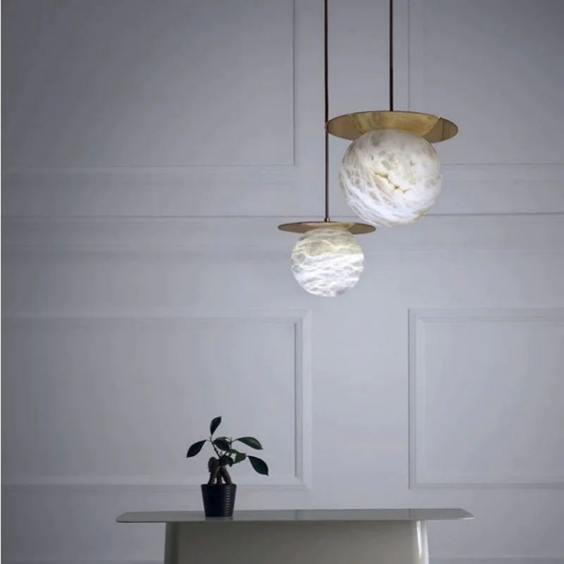 Alabaster Sphere Pendant Light Above Bed front view