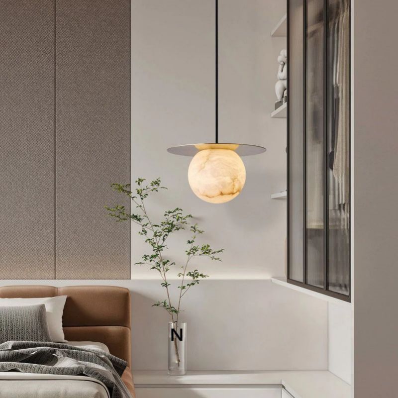 Alabaster Sphere Pendant Light Above Bed angled view