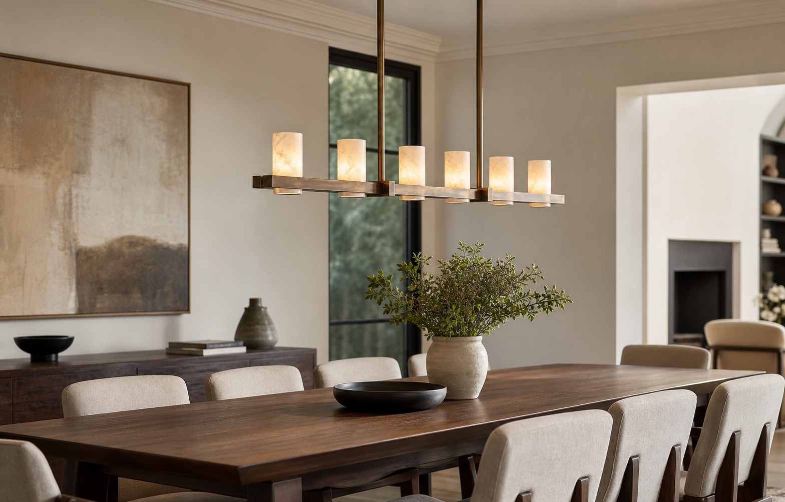 linear chandelier above a rectangular dining table with clear sightlines