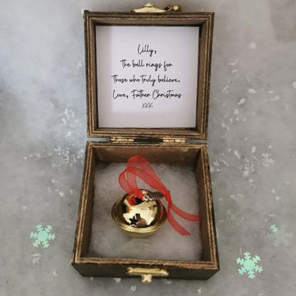 A Beautiful Magical Believe Bell in a Rustic Christmas Eve Box
