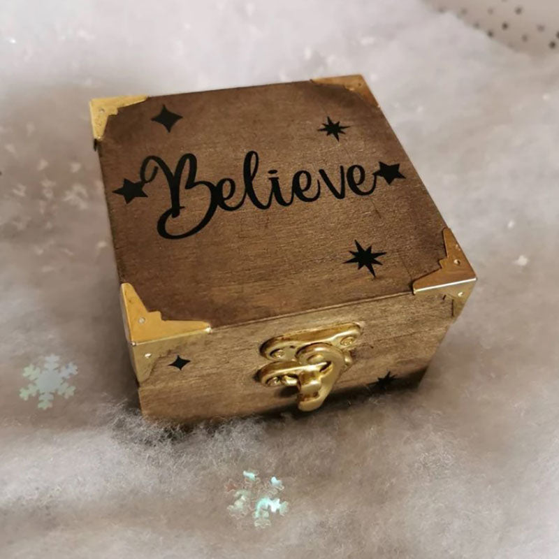 A Beautiful Magical Believe Bell in a Rustic Christmas Eve Box